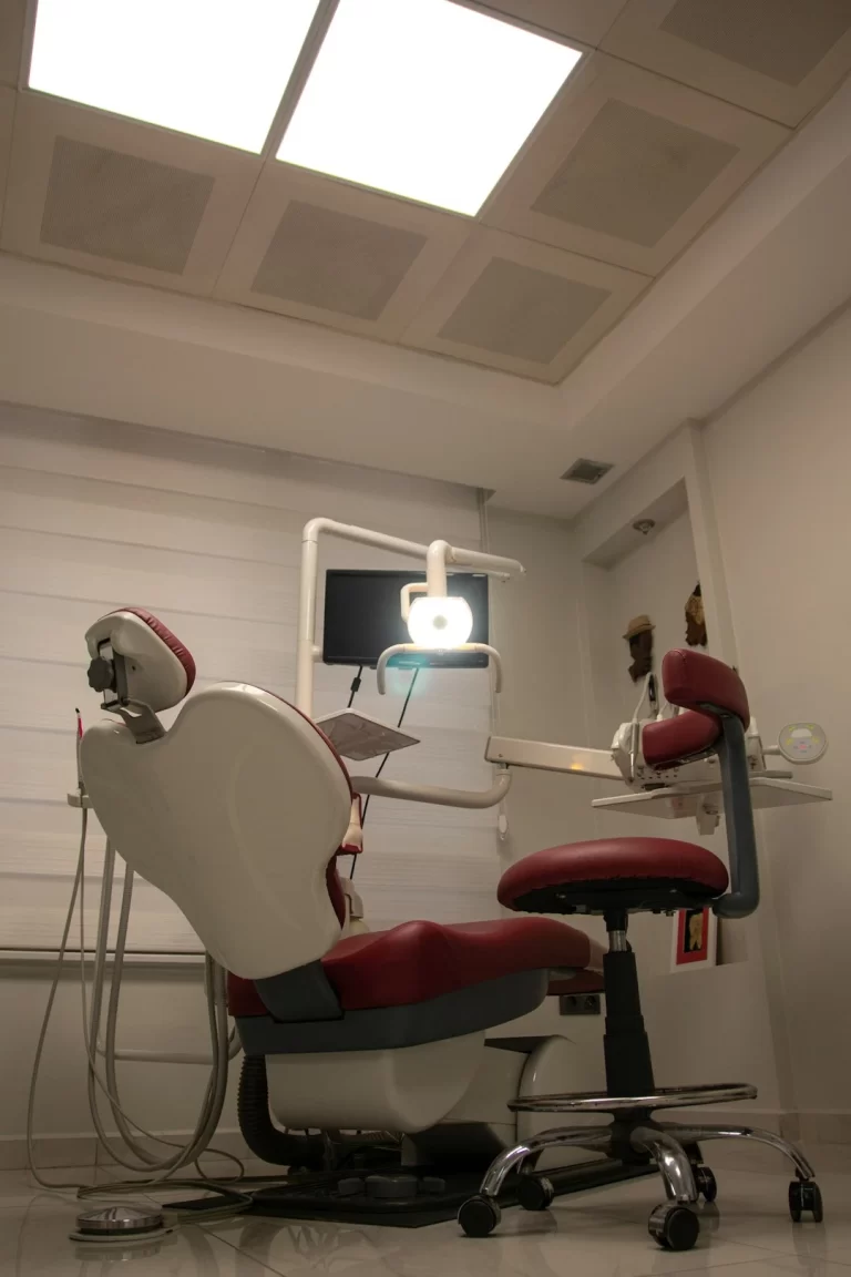 patient exam chair , red color chair - Bales and King Orthodontics